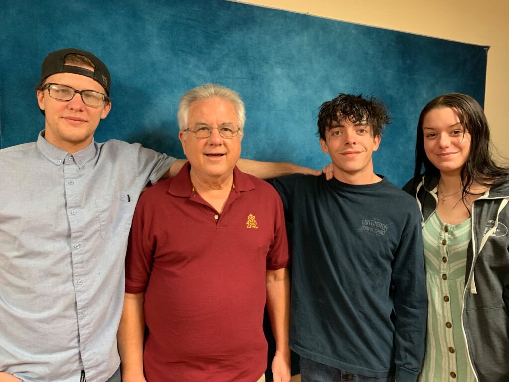 Pastor Jack with three young adults from the church